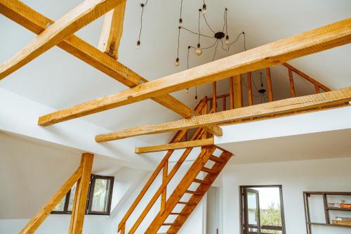 a group of wooden beams in a room at Sunset Hills Chalet in Slănic