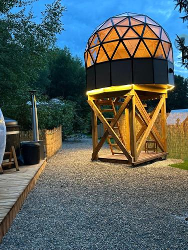 a large wooden structure with a dome on top at Gite Clé des Champs in Montenois