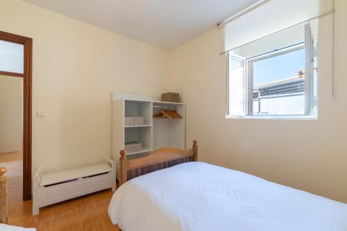 Postel nebo postele na pokoji v ubytování Casa O Souto Cangas