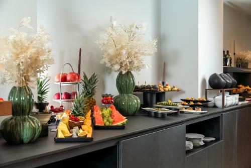 a buffet with many different types of food on a table at Bolina Suite & Spa in Milano Marittima