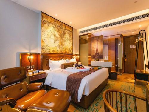 a hotel room with a large bed and a large map on the wall at James Joyce Coffetel Chengdou Wuqing Wanda Plaza in Chengdu