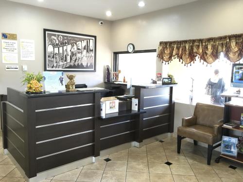 a salon with a waiting room with a chair at Super 8 by Wyndham Salinas in Salinas