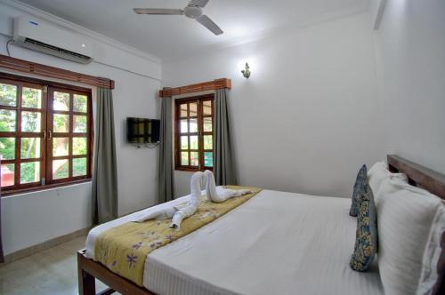 Ένα ή περισσότερα κρεβάτια σε δωμάτιο στο Service Appartment baga