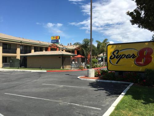 a super sign in a parking lot at Super 8 by Wyndham Salinas in Salinas