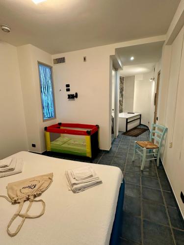 Ένα ή περισσότερα κρεβάτια σε δωμάτιο στο Residenza Petrera