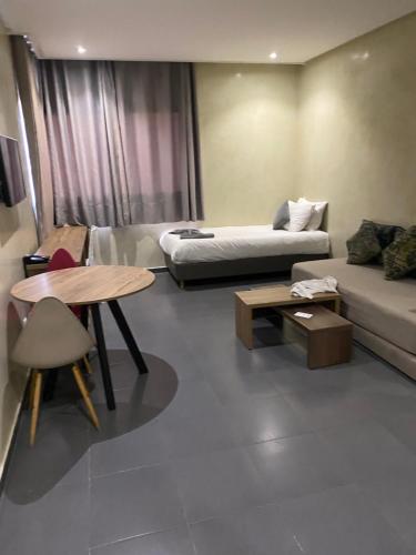 a living room with a couch and a table at Prime Hotel in Northwich