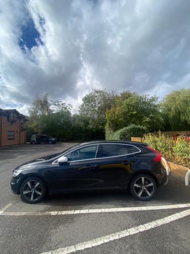a black car parked in a parking lot at Prime Hotel in Northwich