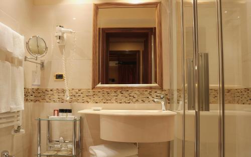a bathroom with a sink and a shower at Hotel Colombina in Venice