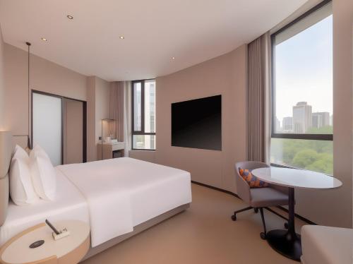 TV a/nebo společenská místnost v ubytování Holiday Inn Express Shanghai on The Bund by IHG