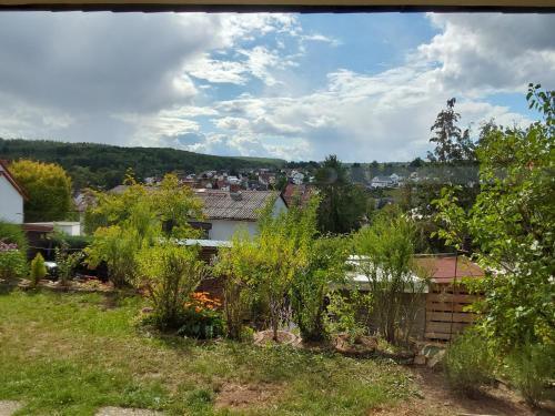 a view of a garden from the roof of a house at Sehr schöne neu renovierte Ferienwohnung Spechthöhle in Wehrheim