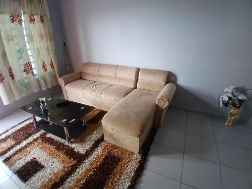 a living room with a couch and a coffee table at Maitidi Place in Paramaribo