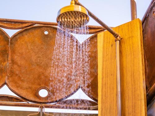 a close up of a hanging lamp with a curtain at Camp Doros in Twyfelfontein