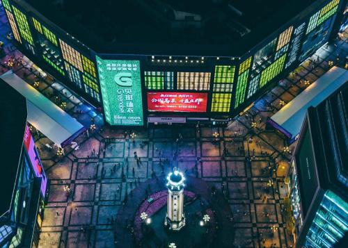 an overhead view of a shopping mall with signs at Pilot Hotel in Chongqing