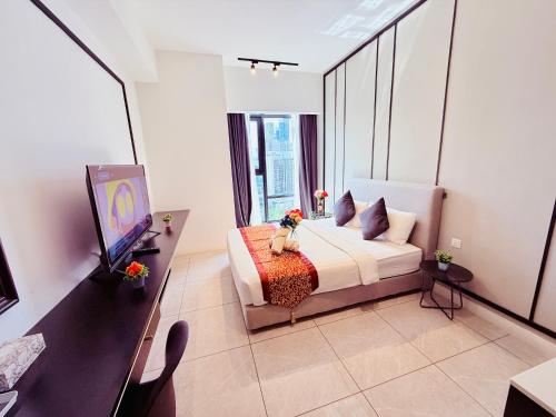 a bedroom with a dog sitting on a bed at Luxury Axon Residence Bukit Bintang KLCC 2 Minutes Walking PAVILION in Kuala Lumpur