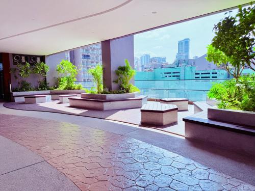 a building with benches and a view of a city at Luxury Axon Residence Bukit Bintang KLCC 2 Minutes Walking PAVILION in Kuala Lumpur