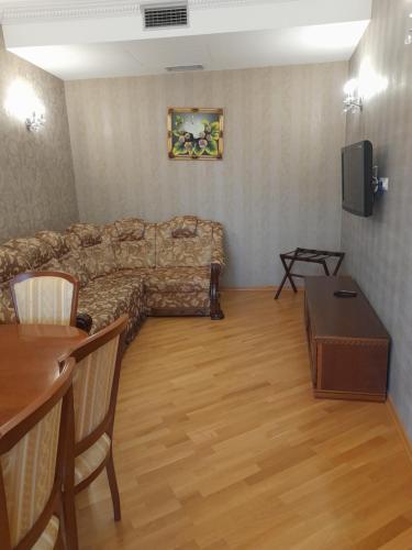 Una televisión o centro de entretenimiento en Apart-Hotel Chale Graal