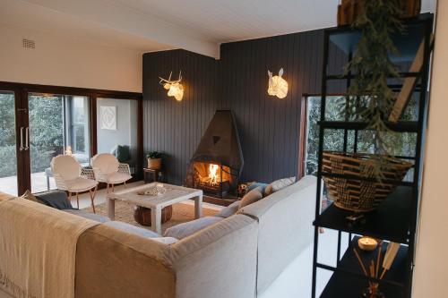 Ένα ή περισσότερα κρεβάτια σε δωμάτιο στο Rooi Els Sea Cottage