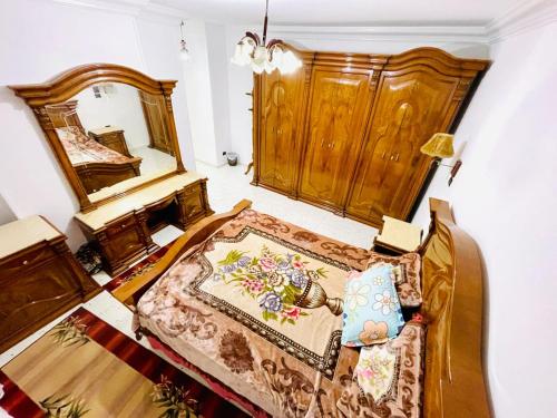 Ένα ή περισσότερα κρεβάτια σε δωμάτιο στο سان هوتيل للشقق الفندقيه