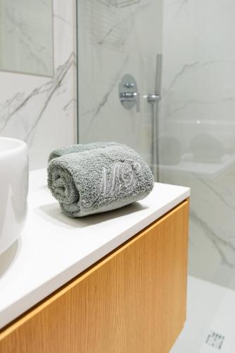 a towel sitting on a counter in a bathroom at Bellevue | Sea & River View | Garage in Canidelo