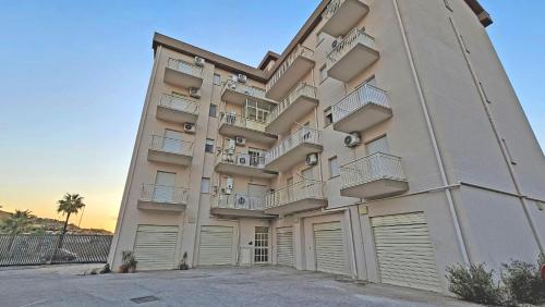 a large apartment building with a lot of garage at Tenute D'Angelo - Holidays, Relax & Wellness - Casa vacanze ad Agrigento in Agrigento
