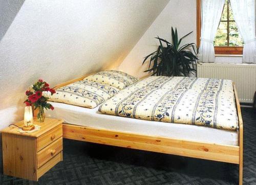 Ένα ή περισσότερα κρεβάτια σε δωμάτιο στο Ferienwohnungen Ihle