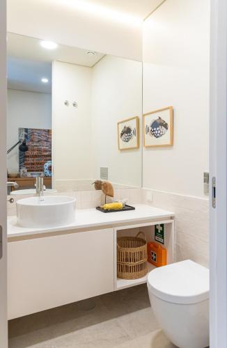 a white bathroom with a toilet and a sink at Ocean Living by MP in Vila Nova de Gaia