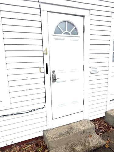 a white door with a window on a house at Downtown Willoughby historical district Gem 4 in Willoughby