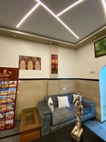 a living room with a couch and a table at Aladdin Sphinx & Pyramid Stay in Cairo