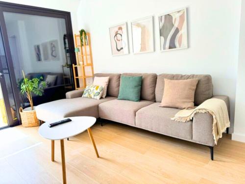 a living room with a couch and a table at Cozy & Terrace Apartament5 in Los Cristianos