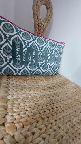a pillow on top of a bed with a wicker at Clifftop Mews - Westcliff - Ramsgate - Pet friendly! in Kent