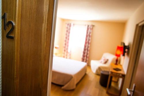 Postel nebo postele na pokoji v ubytování Hotel Cesario