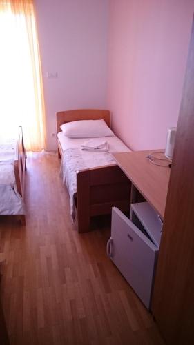 Ένα ή περισσότερα κρεβάτια σε δωμάτιο στο Guest House Lav