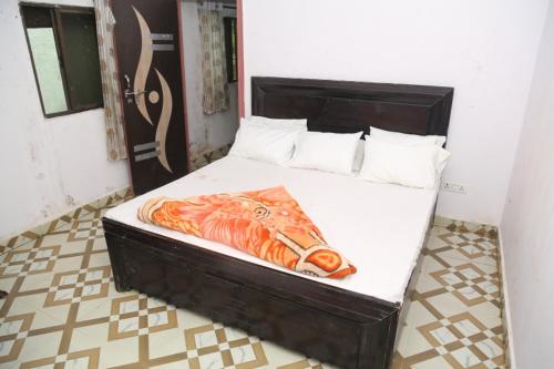 Postel nebo postele na pokoji v ubytování Sun City Resort & Restaurant