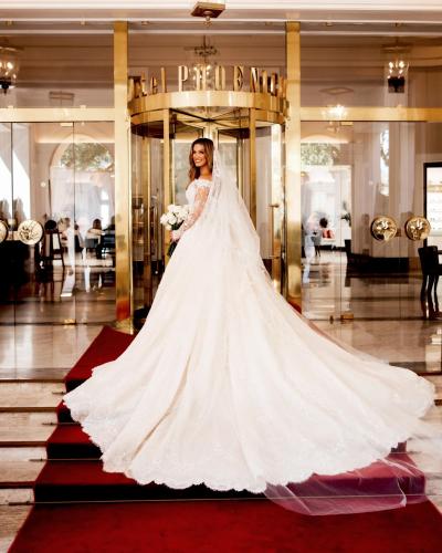 a bride in a wedding dress in a lobby at The Phoenicia Malta - The Leading Hotels of the World in Valletta