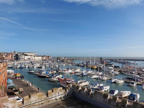 a harbor filled with lots of boats in the water at Clifftop Mews - Westcliff - Ramsgate - Pet friendly! in Kent