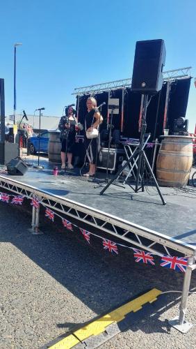 a group of people on a stage with a band at Clifftop Mews - Westcliff - Ramsgate - Pet friendly! in Kent