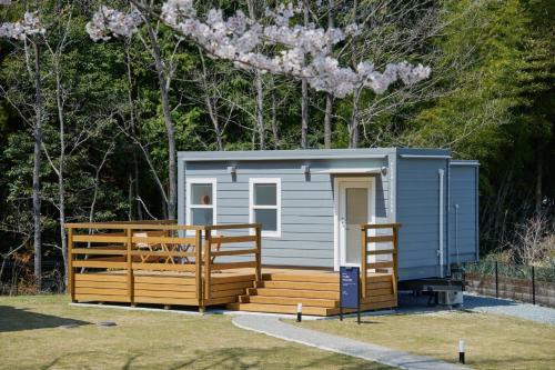 a small blue shed with a wooden fence at Class Besso Ise - Vacation STAY 61661v in Iseji
