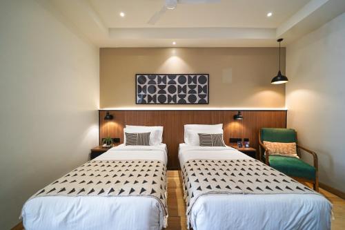 Ένα ή περισσότερα κρεβάτια σε δωμάτιο στο Olive Hotel Benz Circle, Vijayawada by Embassy Group