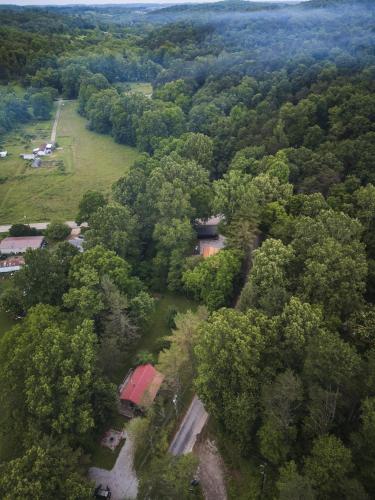 an aerial view of a house in the middle of a forest at Little Redwood - Hocking Hills, Hot Tub & Games in Logan