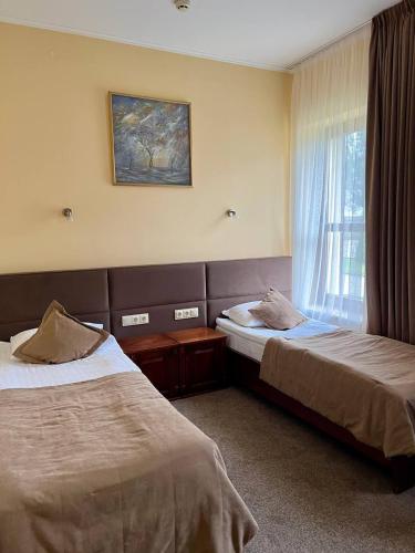 Una cama o camas en una habitación de Hotel Kopa - Lviv