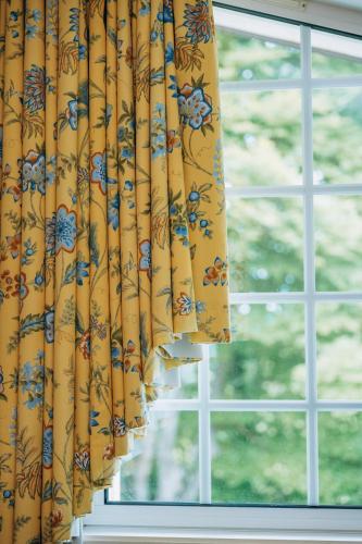 a curtain in front of a window at Chalet La Forestière in Saint-Paul-en-Chablais