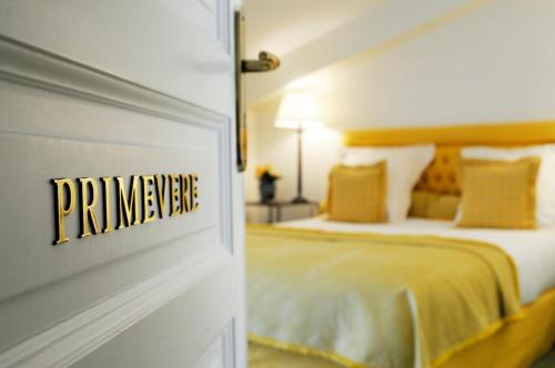 a bedroom with a bed with a sign on the wall at Chalet La Forestière in Saint-Paul-en-Chablais