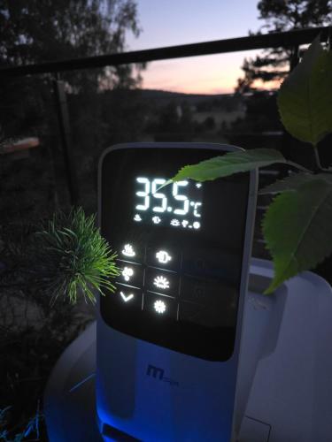 an electronic clock sitting on top of a table at Sveti Pantelejmon Divčibare in Divčibare