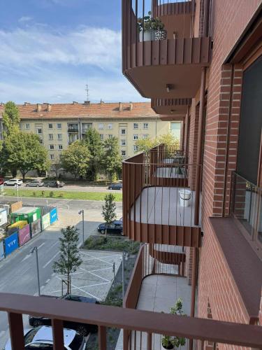 a balcony of a building with a stairwell and a street at Zwirn Bratislava in Nivy