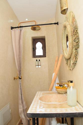a bathroom with a sink in a room at Wild Valley Ouirgane in Ouirgane