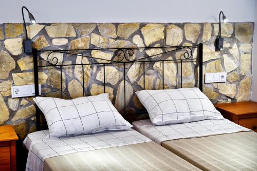 En eller flere senge i et værelse på GlampINN Fuente Obejuna