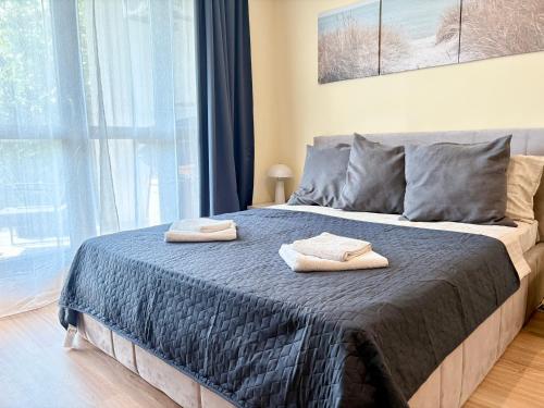 Postel nebo postele na pokoji v ubytování Wave & Wellness Studio