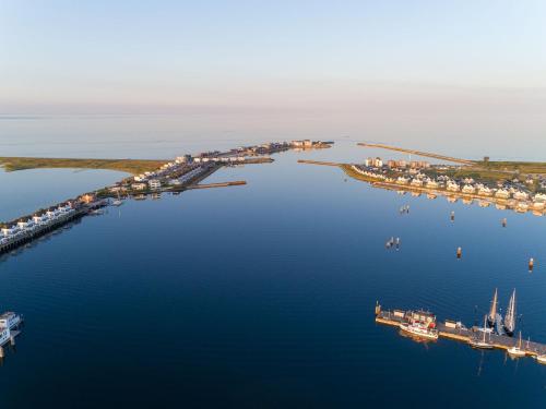 an aerial view of a harbor with boats in the water at BeachTerraceThree- EG, barrierearm, Meerblick, Terrasse, Kamin, Sauna in Olpenitz
