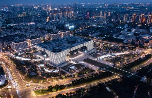 an aerial view of a large building at night at Changzhou Wenpu Hotel Changzhou Culture Square Branch in Changzhou