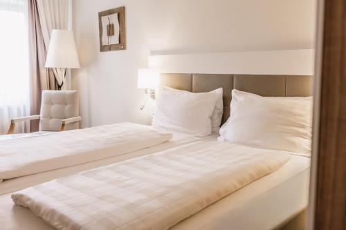 Un ou plusieurs lits dans un hébergement de l'établissement Steigenberger Hotel & Spa Krems